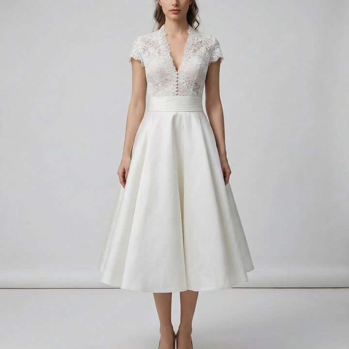 Chic A-line midi wedding dress featuring a delicate lace bodice, ideal for a special occasion.