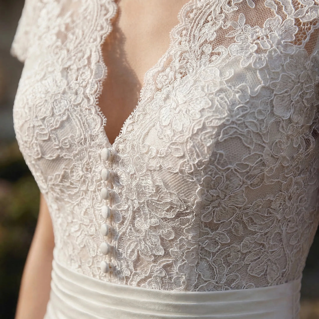 Formal midi bridal gown with an elegant lace overlay, designed for a memorable wedding day.