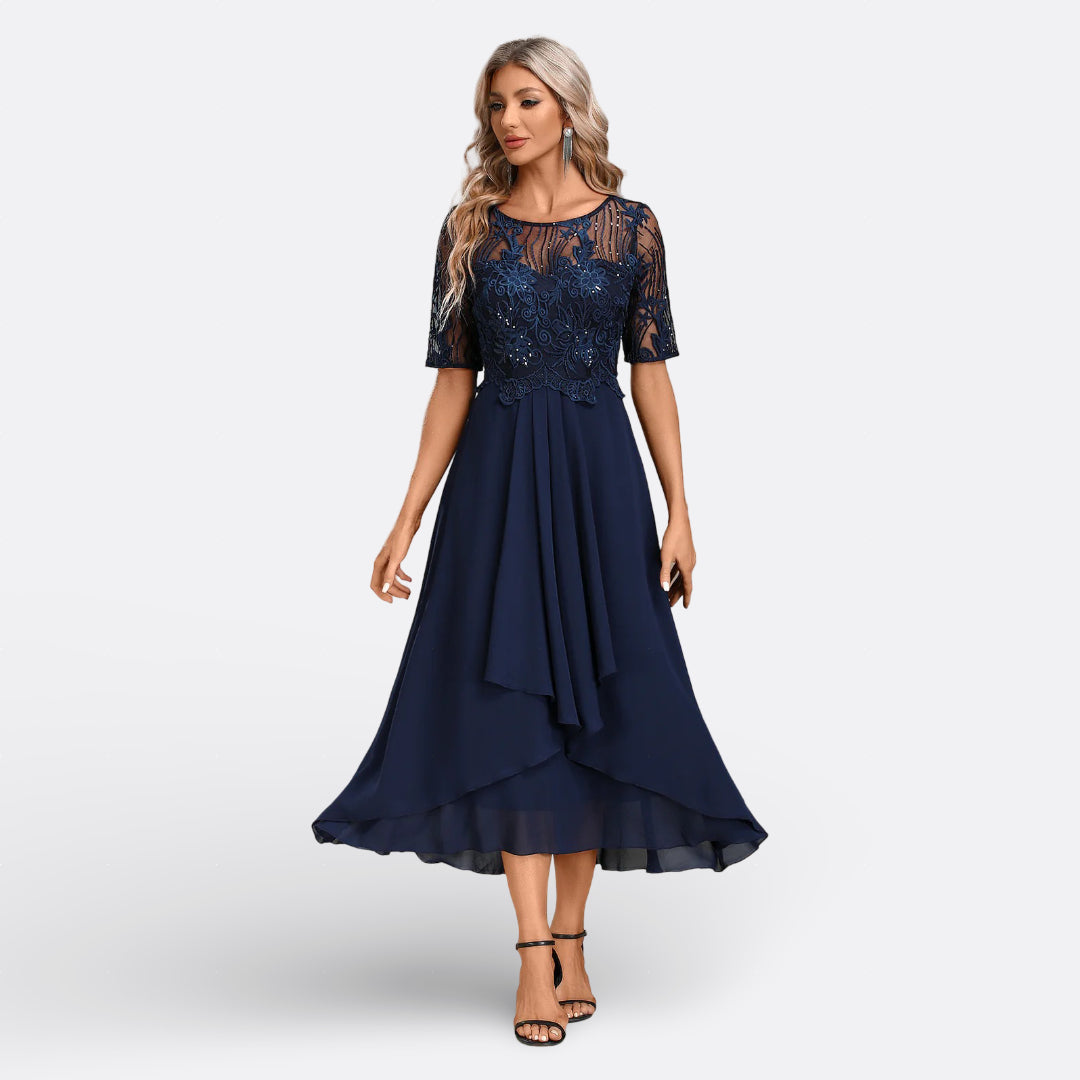 Elegant women's lace midi dress, perfect for evening wear & special occasions. Features intricate lace.