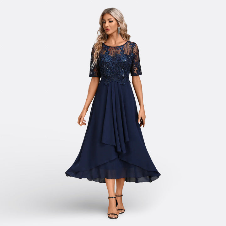 Elegant women's lace midi dress, perfect for evening wear & special occasions. Features intricate lace.