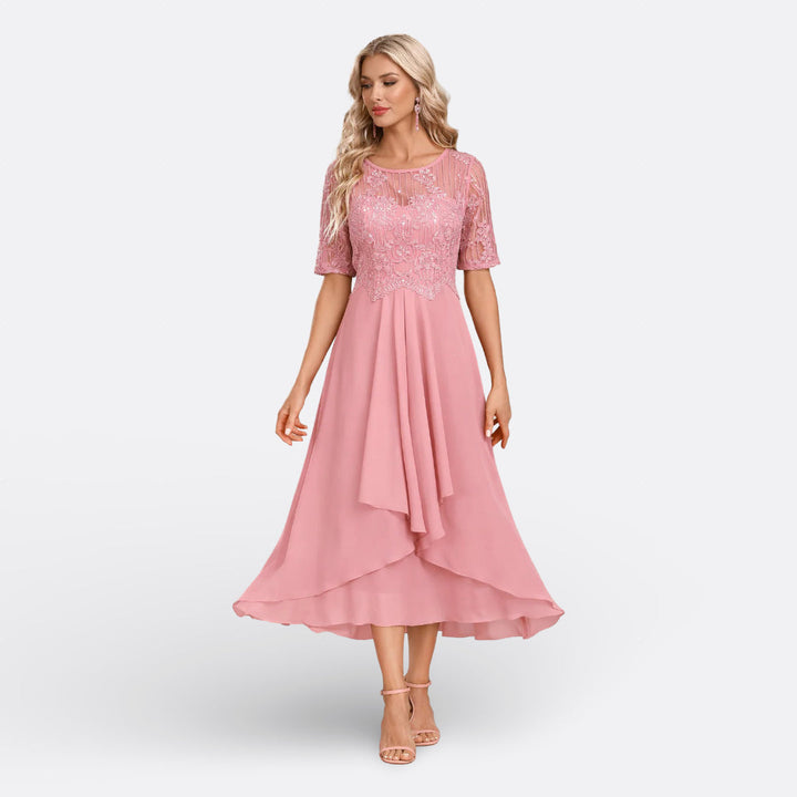 Beautiful women's elegant lace midi dress with delicate details, perfect for evening events.