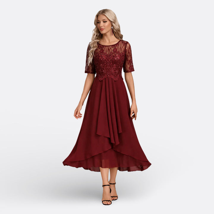 Intricate lace pattern elegant midi dress for women, ideal for formal wear and special occasions.