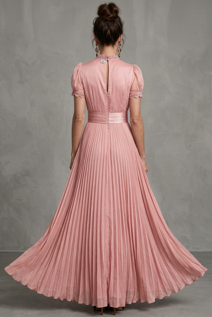 Close-up of a women's pleated maxi dress, showcasing intricate lace trim detail & elegant high neckline.