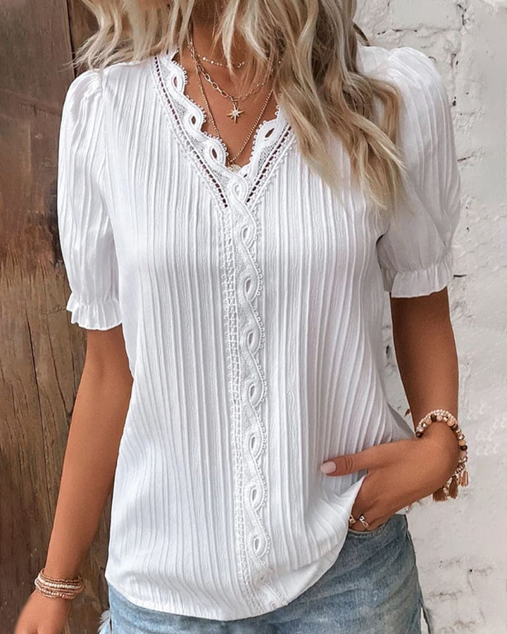 Chic V-neck lace top for women, ideal for dressy or casual summer wear.