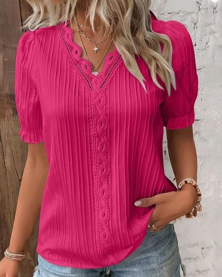 Plus size elegant lace blouse with a flattering V-neck, offering romantic style.