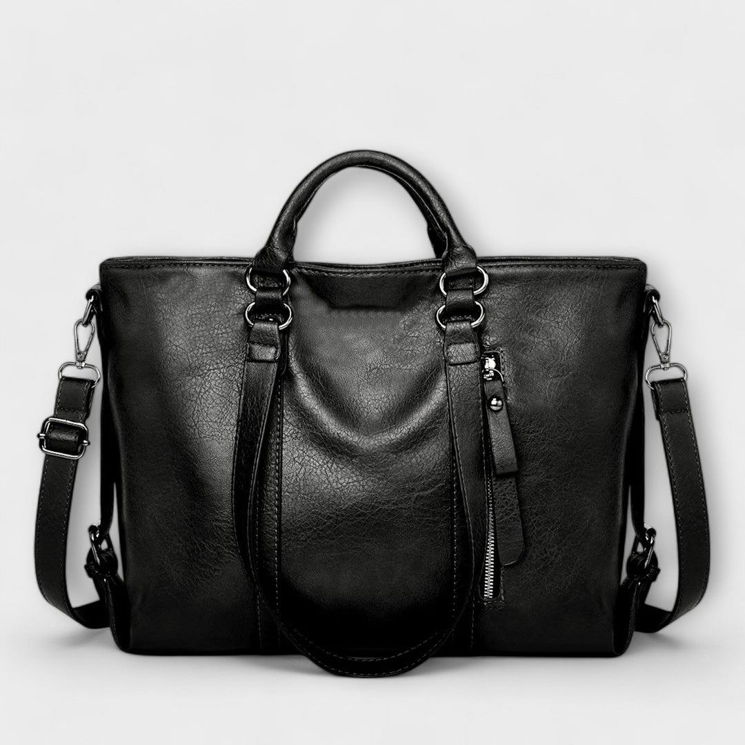 Stylish black leather shoulder tote bag for women, ideal as a work or travel bag with large capacity.