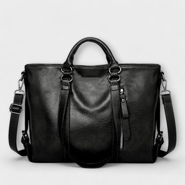 Stylish black leather shoulder tote bag for women, ideal as a work or travel bag with large capacity.