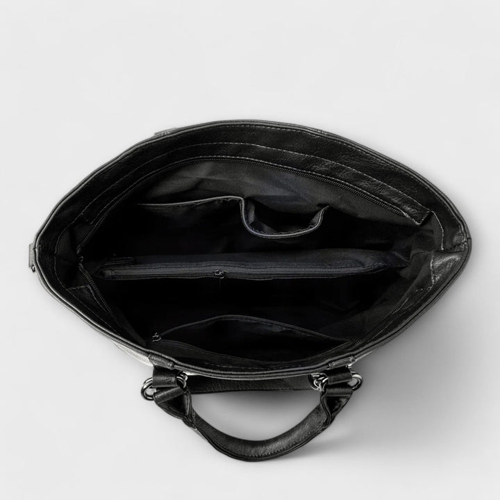 Chic blue leather tote bag for women, a fashionable and spacious shoulder bag for everyday elegance.