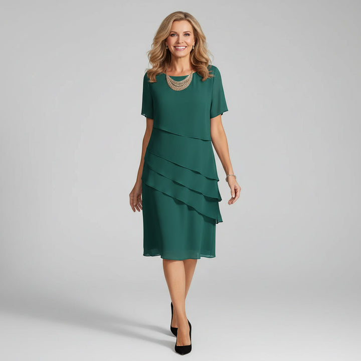 Women's celebration dress: sophisticated layered chiffon midi style.