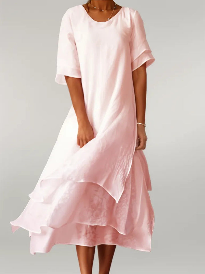Elegant women's layered midi dress in flowy fabric, perfect for special occasions & versatile styling.