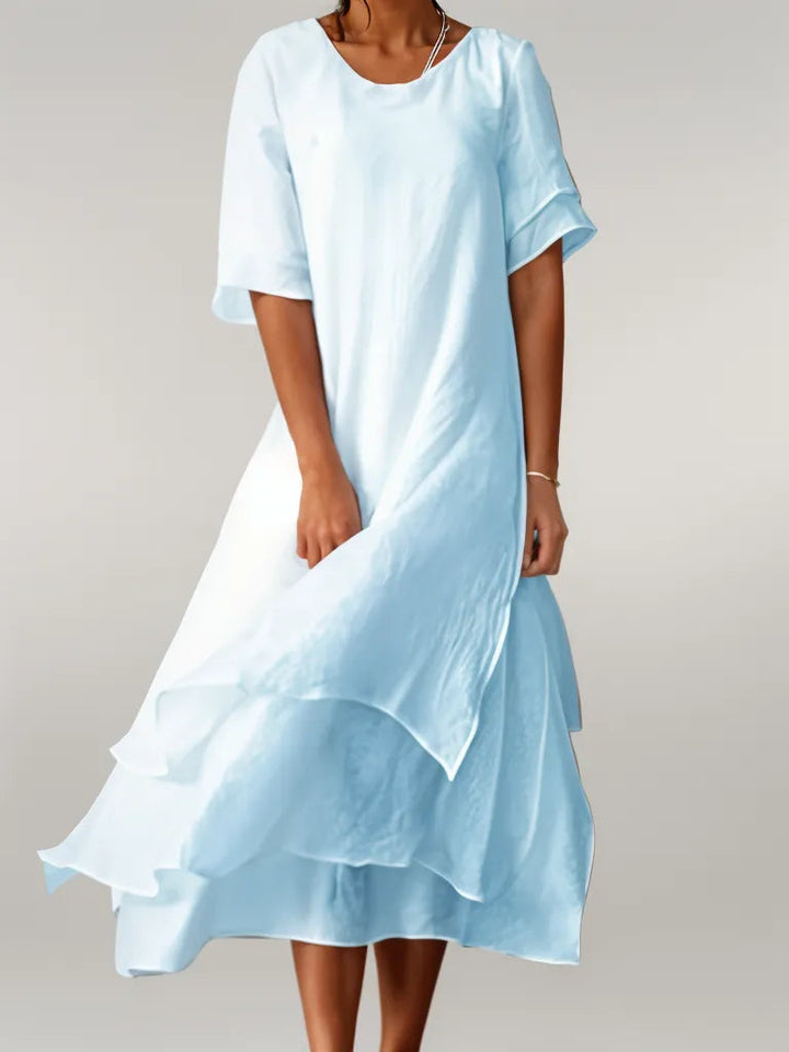 Flowy, elegant women's layered midi dress. A versatile summer, party, or casual dress for women.