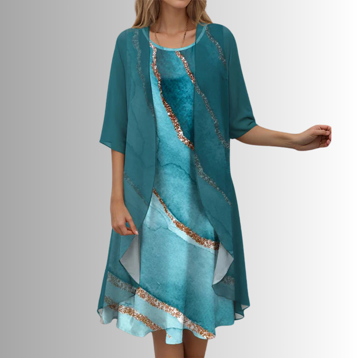 Model wearing an elegant women's layered open front midi dress. Flowing, stylish, occasion wear.