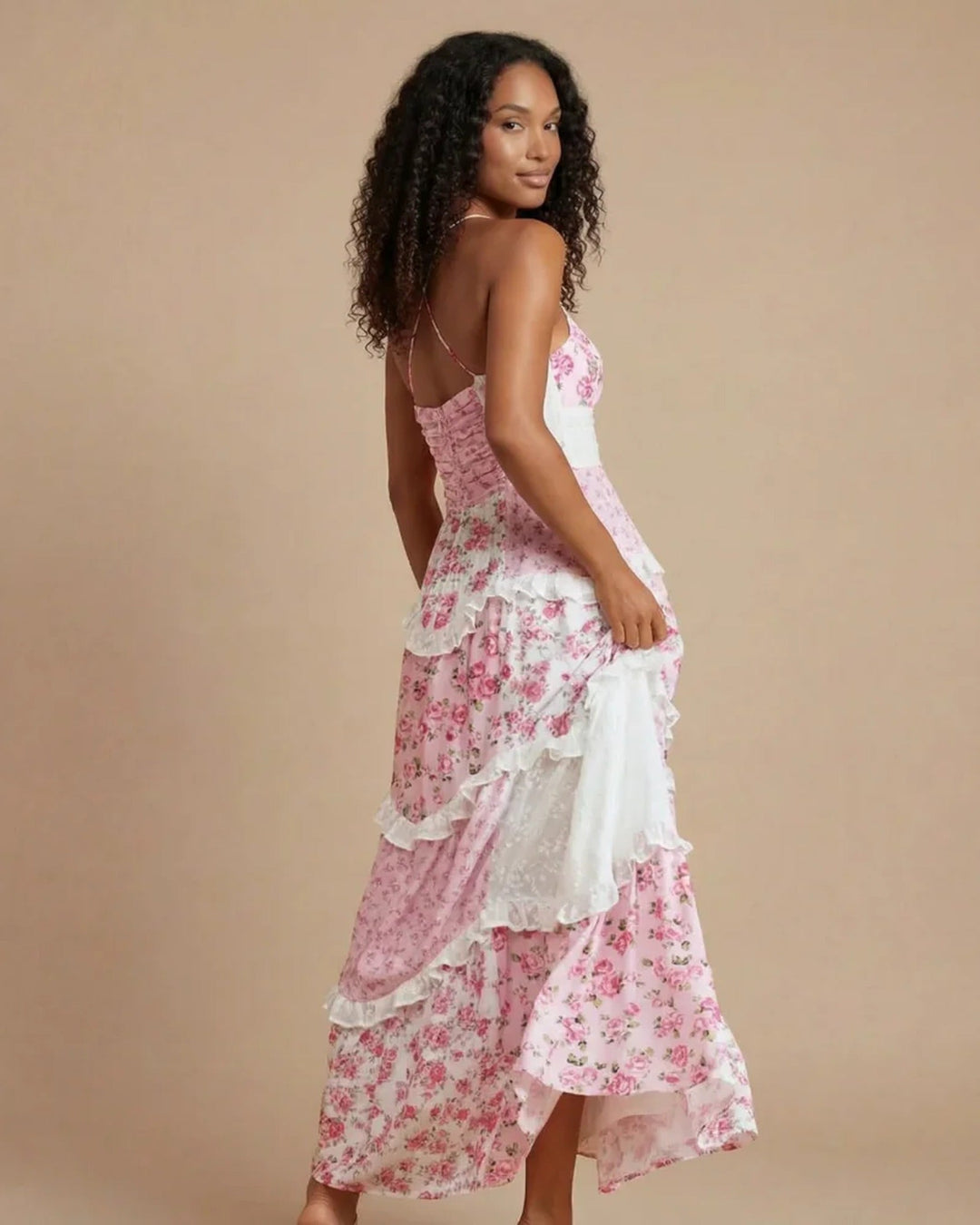 Stunning women's maxi evening gown with a dramatic open back and elegant layered ruffles. Formal special event dress.