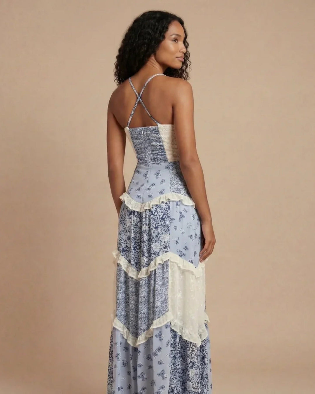 Formal women's flowing maxi evening dress with elegant layered ruffles and a flattering open back. Perfect for events.