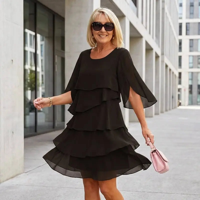 Stylish women's layered ruffle dress with three-quarter sleeves; an elegant midi for any occasion.