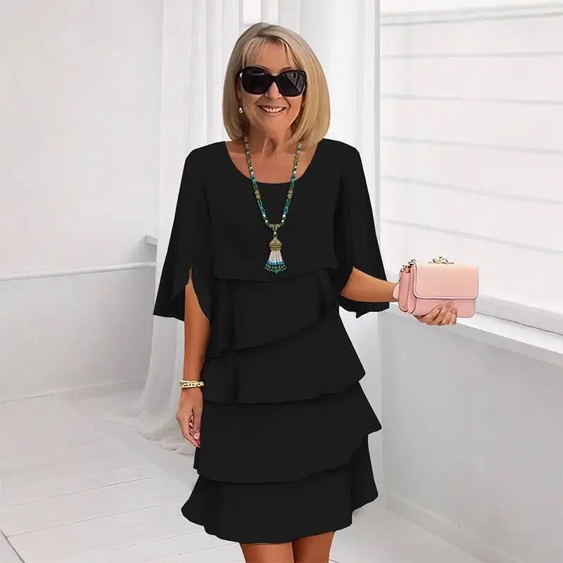 Women's elegant layered ruffle midi dress, featuring graceful three-quarter sleeves. Perfect for chic fashion.