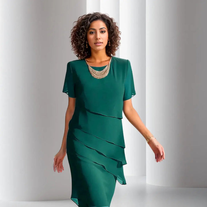 Feminine short sleeve midi tiered dress, ideal as a wedding guest or formal occasion wear.
