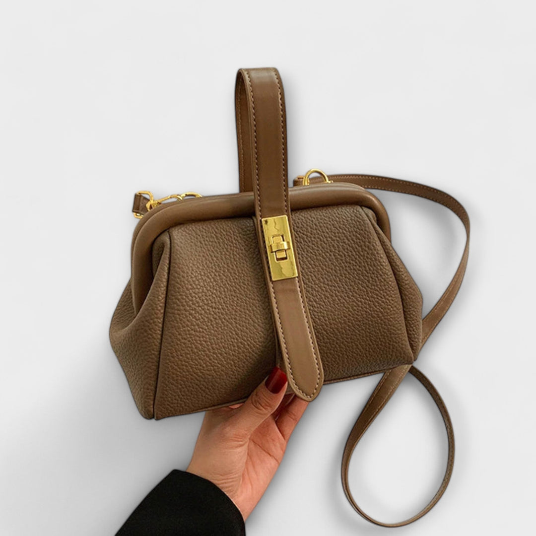 Fashion-forward red leather mini shoulder bag for women, featuring a stylish turn lock mechanism.