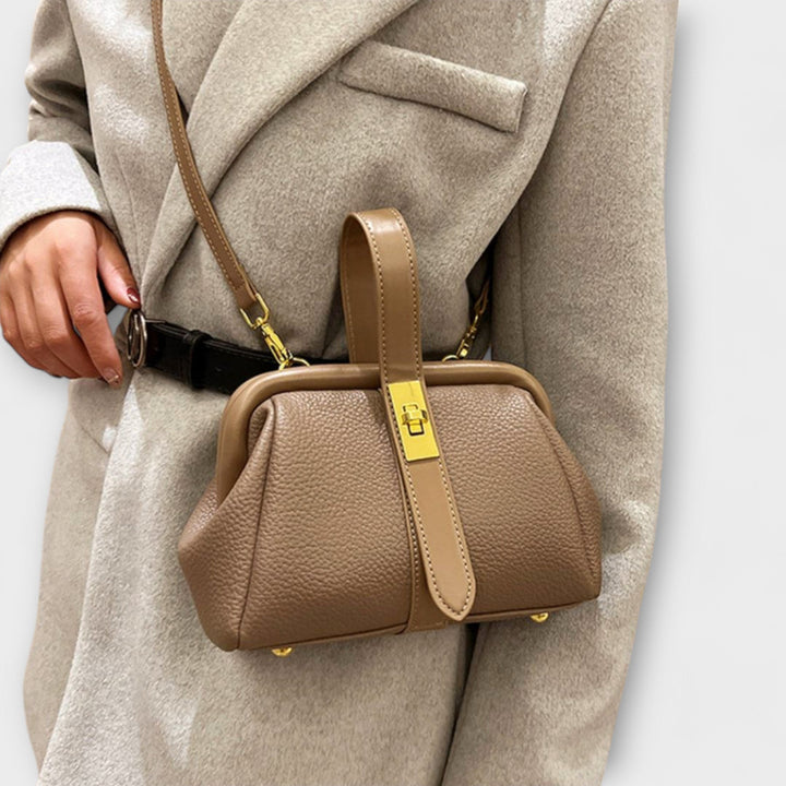 Trendy khaki women's leather crossbody bag, offering modern style and a functional turn lock.