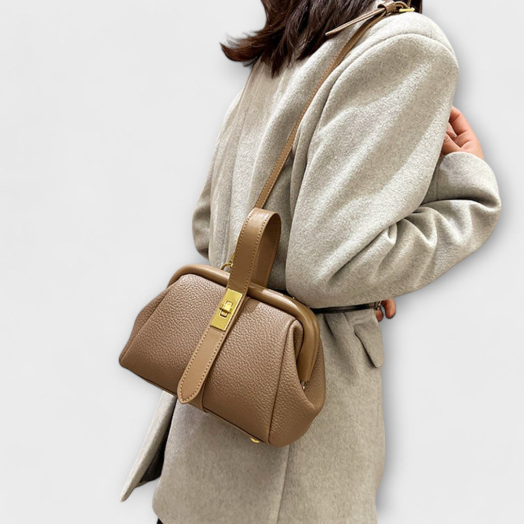 Bold red elegant leather mini handbag, a statement accessory with a prominent turn lock.