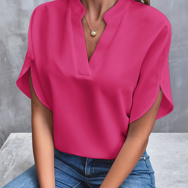 A model showcases the women's lightweight blouse, highlighting its elegant drape.