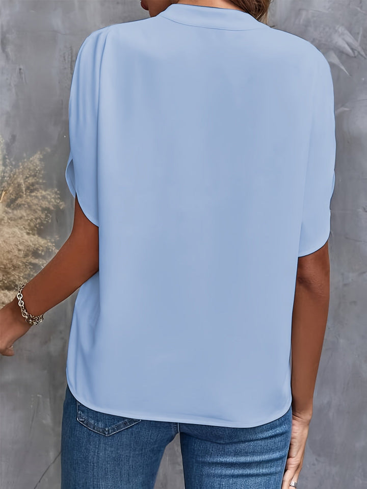 Lightweight women's blouse in a vibrant color, perfect for spring outfits.