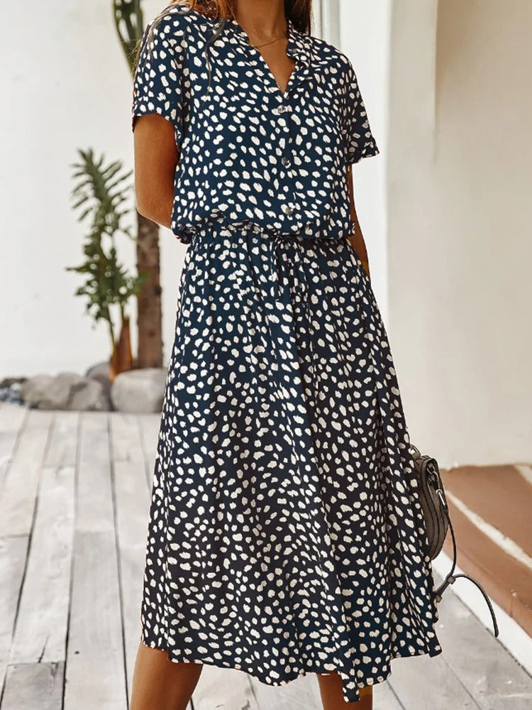 Women's flowy summer midi dress, elegant and lightweight, perfect for a sophisticated casual or vacation style.