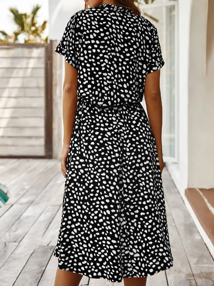 Women's elegant summer midi dress, lightweight and flowy, great for a relaxed fit on vacation or daywear.