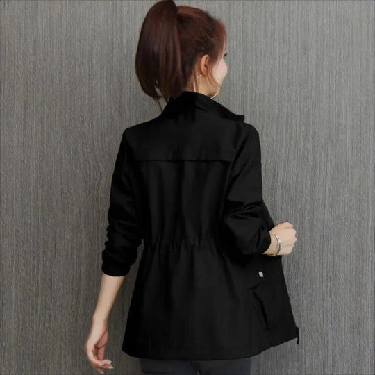 Women's sleek waterproof trench coat, a lightweight rain jacket for elegant style. Perfect weather-resistant outerwear.