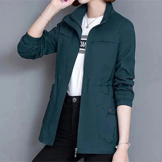 Stylish women's lightweight waterproof trench coat, ideal as a rain jacket for versatile spring & fall fashion.