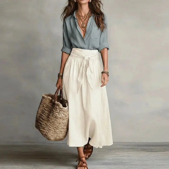 Elegant women's linen co-ord set with button-down top & midi skirt, perfect for summer fashion.