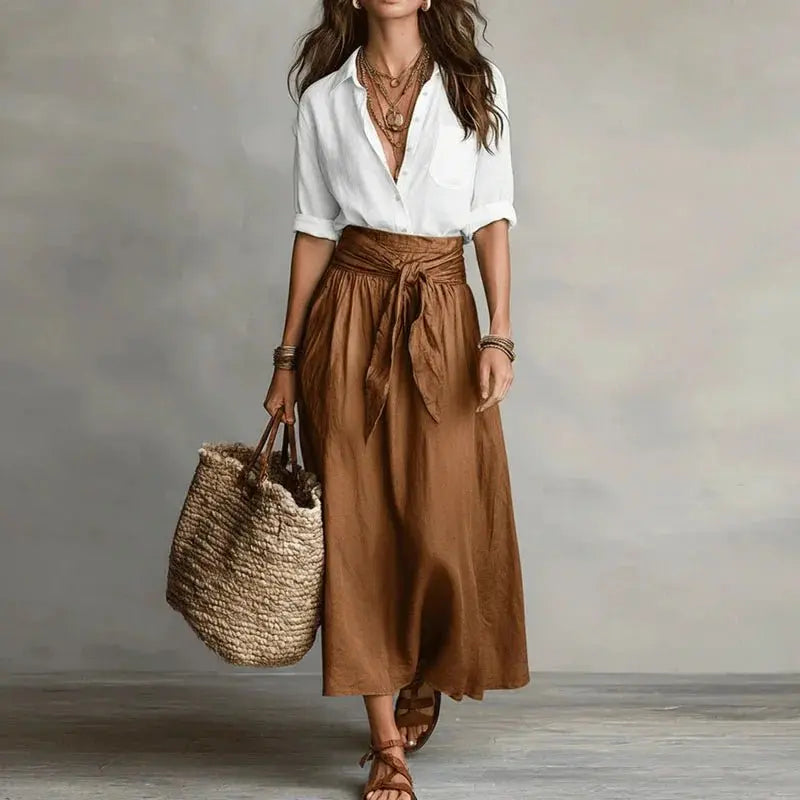 Stylish two-piece women's outfit: button-down linen top & matching midi skirt for casual chic look.