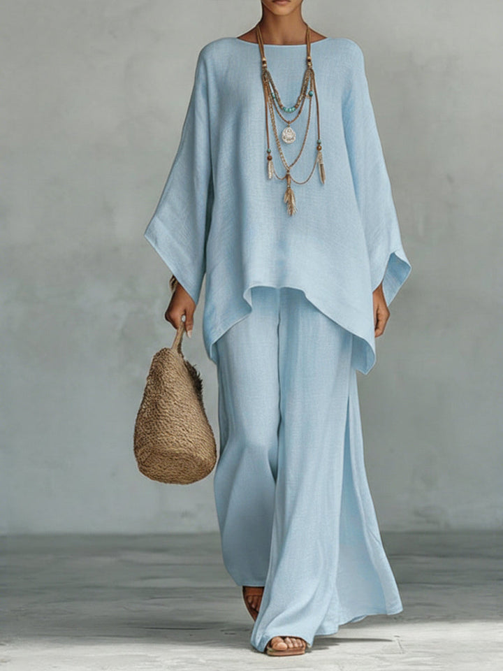 Relaxed fit women's two-piece linen trouser set. Features wide sleeves & comfy wide leg pants for versatile wear.