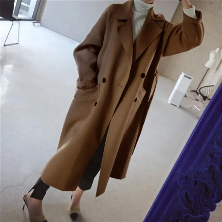 Tailored women's double-breasted midi coat. Classic cashmere overcoat, perfect for elegant winter fashion and outerwear.