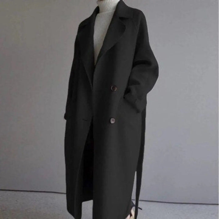 Women's classic double-breasted long cashmere overcoat. Elegant winter outerwear, ideal for cold weather style.