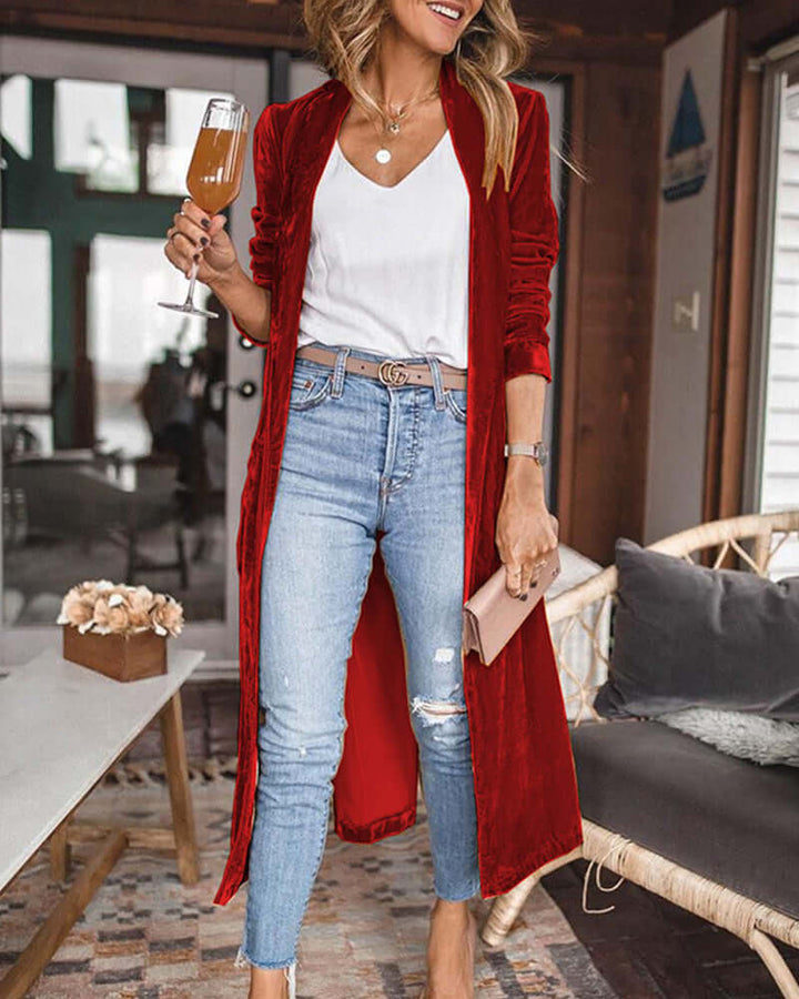 Close-up of elegant women's long duster cardigan, showcasing knit detail and relaxed fit.