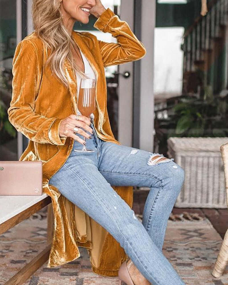 Women's long duster cardigan paired with outfit, highlighting its versatile and elegant layering.
