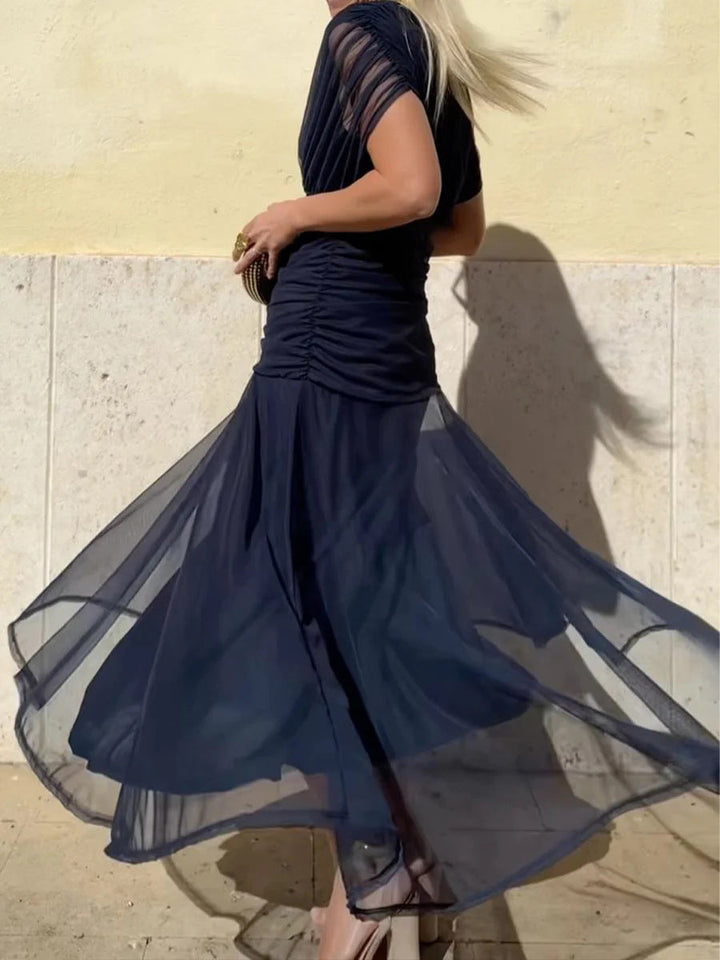 Stylish women's long floral V-neck maxi dress, embodying elegant summer fashion with its flowing design.