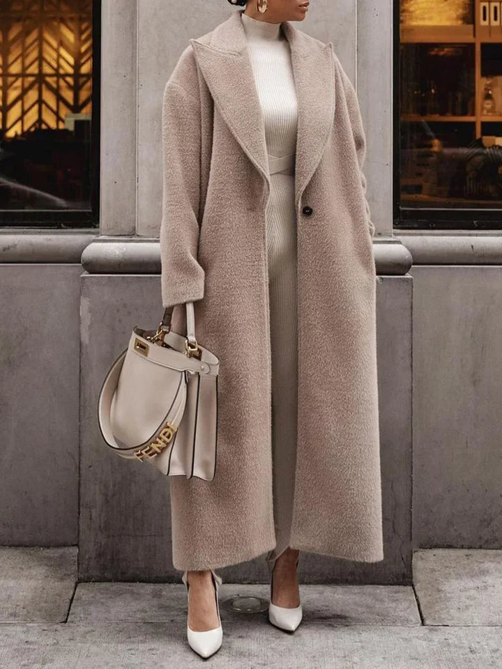 Stylish white oversized women's long coat, an elegant outerwear piece for modern winter fashion & casual chic.
