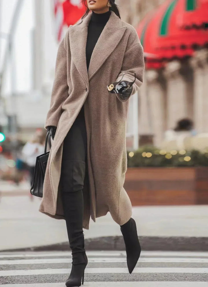 Fashionable women's long oversized winter coat, providing warmth and elegant style for cold weather outerwear.