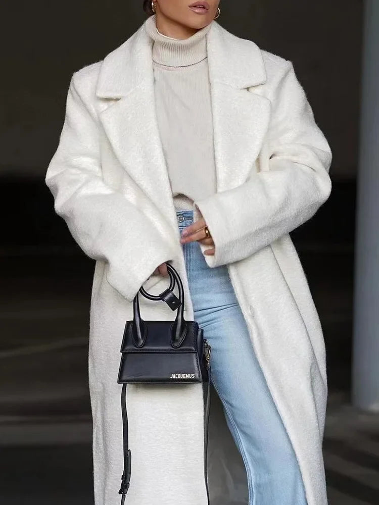 Casual chic women's long oversized jacket, a stylish winter coat with a modern silhouette for elegant outerwear.