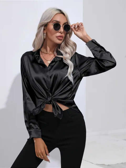 Sophisticated women's top with long sleeves, offering a versatile and elegant look for work or casual wear.