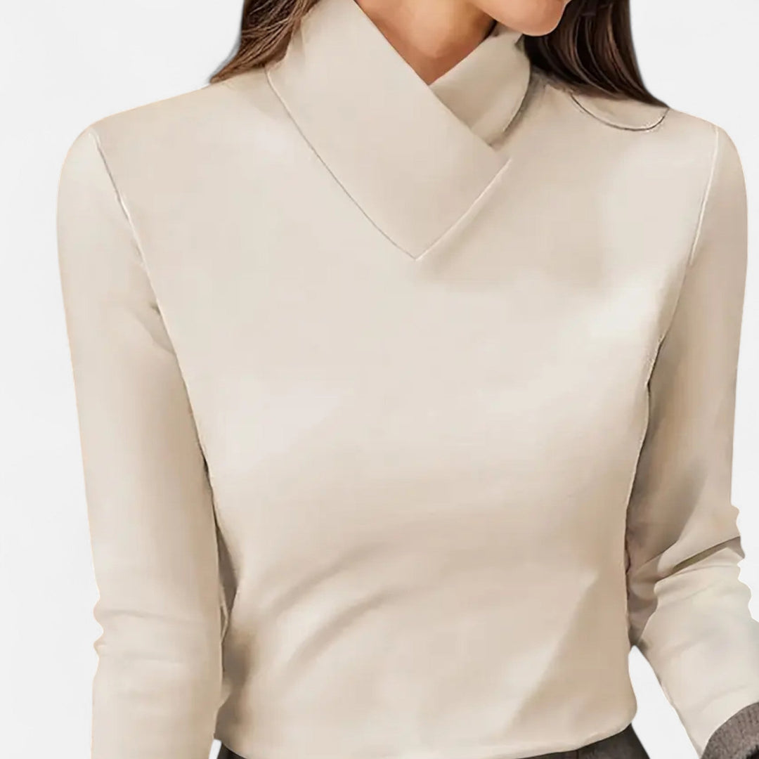Elegant women's long sleeve blouse with sophisticated criss-cross neckline and contrast collar.