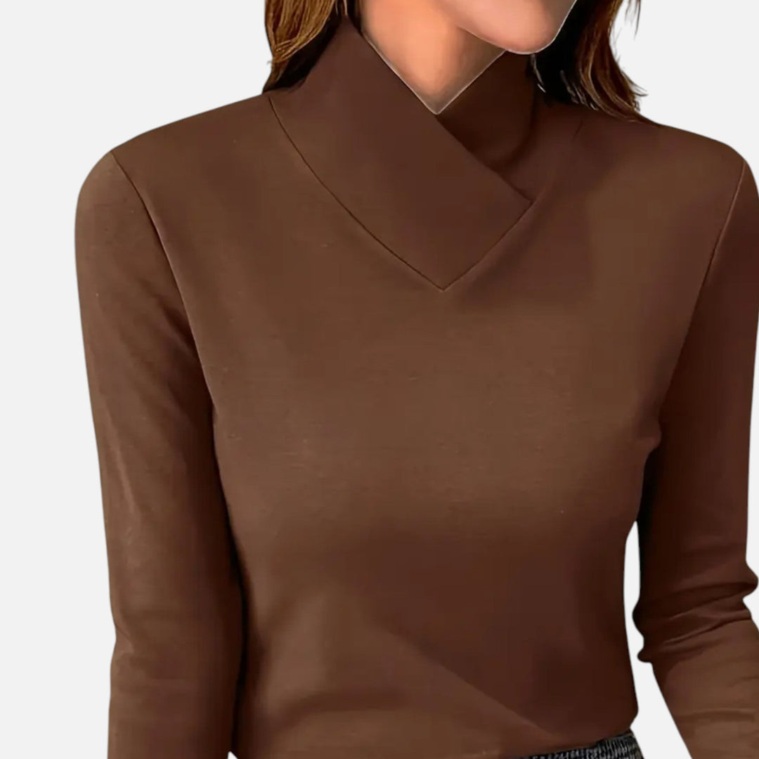 A versatile women's long sleeve blouse with a modern criss-cross neck, ideal for any wardrobe.