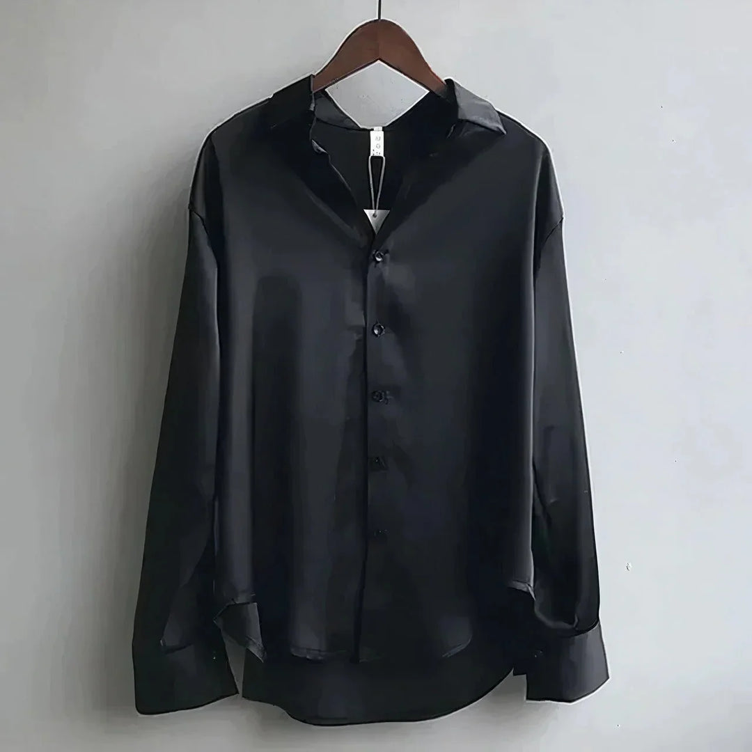 Stylish women's long-sleeve button-down top, great for office outfits or smart casual ensembles.