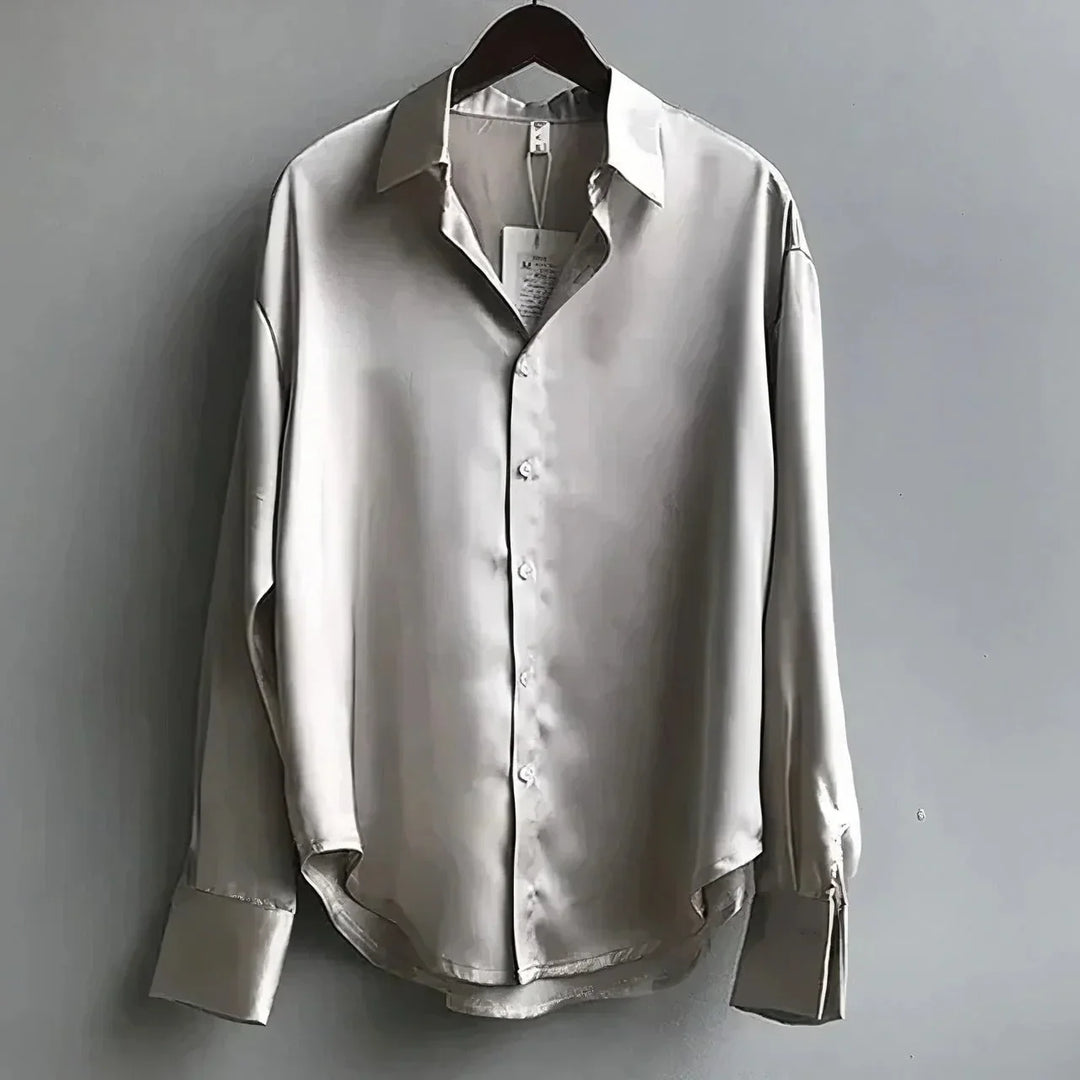 Fashionable women's elegant blouse featuring long sleeves & a classic button-down design.