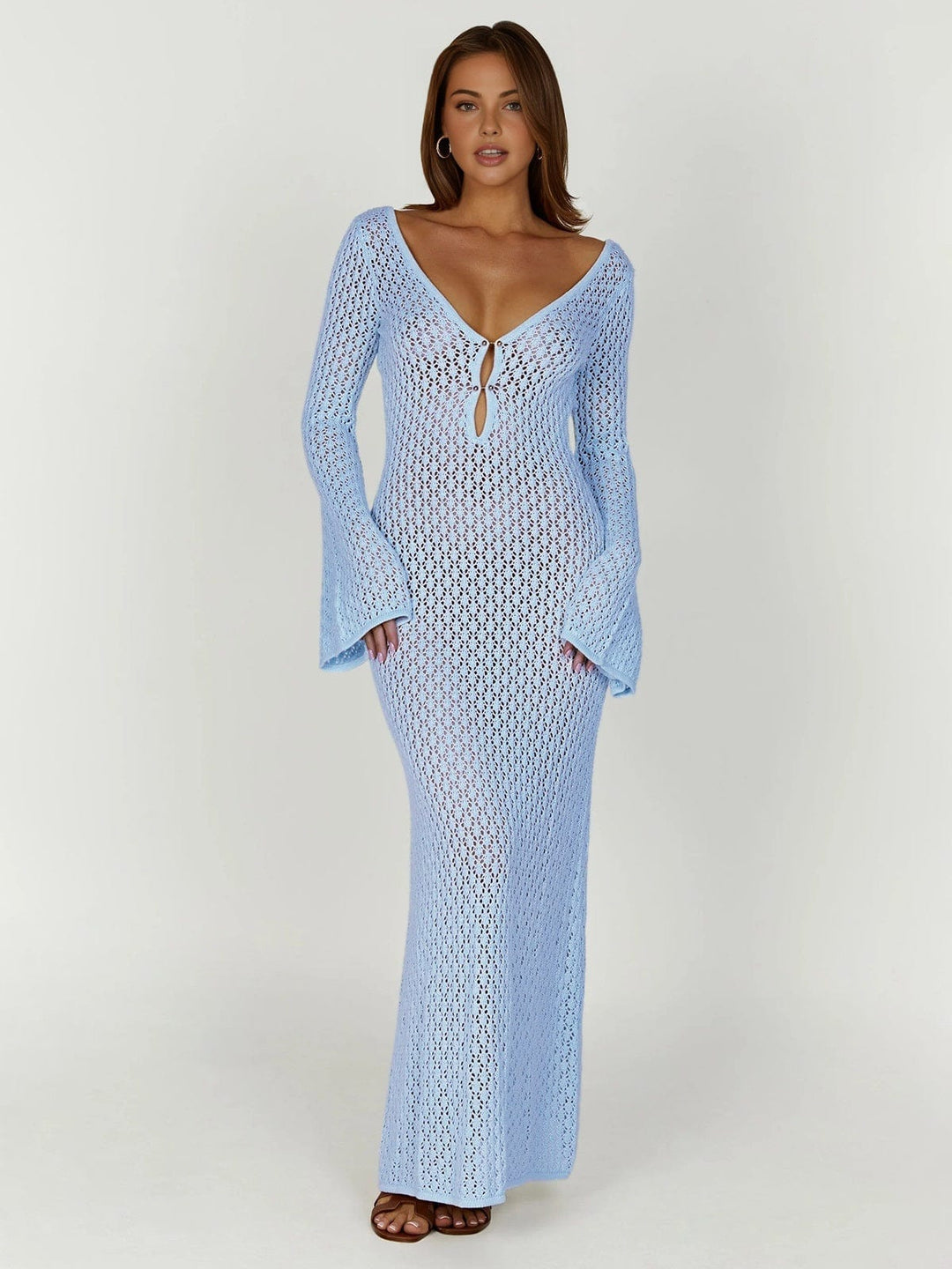 Full length view of a women's long sleeve button front maxi dress, designed for elegance & comfort.