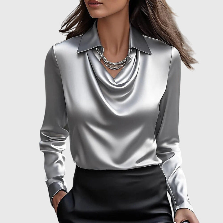 Versatile long sleeve collared blouse for women, featuring a relaxed fit. Ideal for office wear or casual elegance.