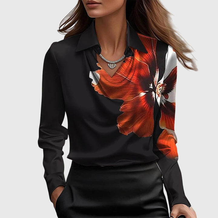 Classic women's collared blouse with long sleeves, offering an elegant look and relaxed fit for various occasions.