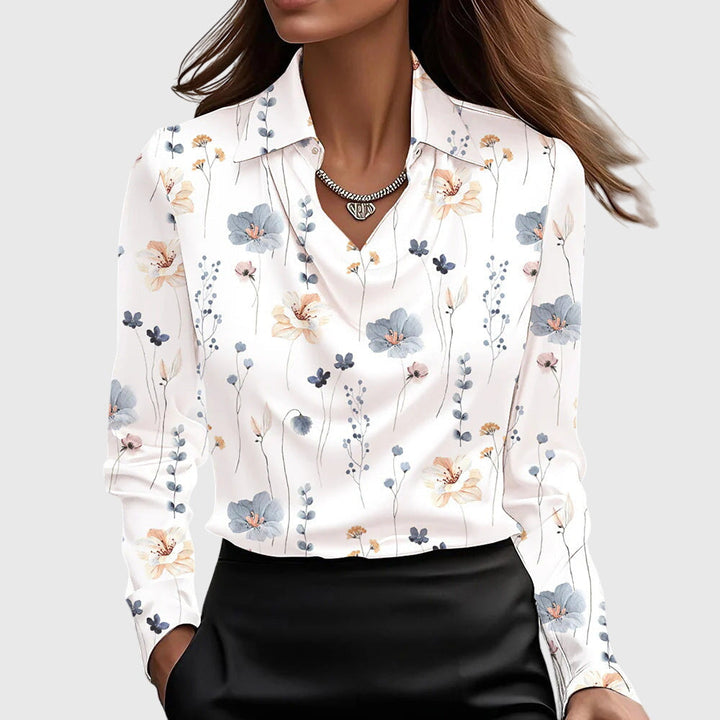 Fashionable women's elegant long sleeve blouse. This collared, relaxed fit top is a versatile addition to any wardrobe.